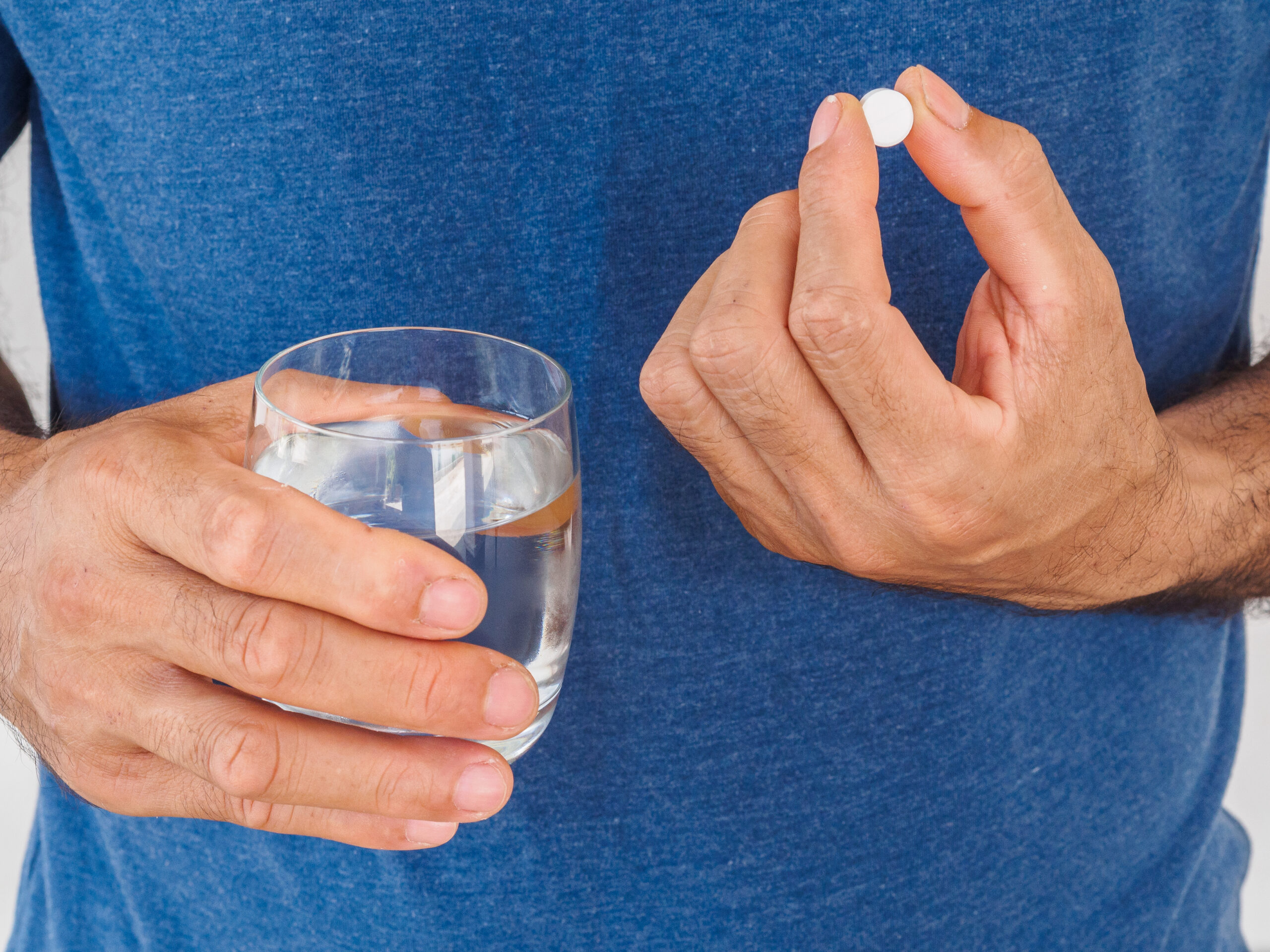 Man taking medication as prescribed