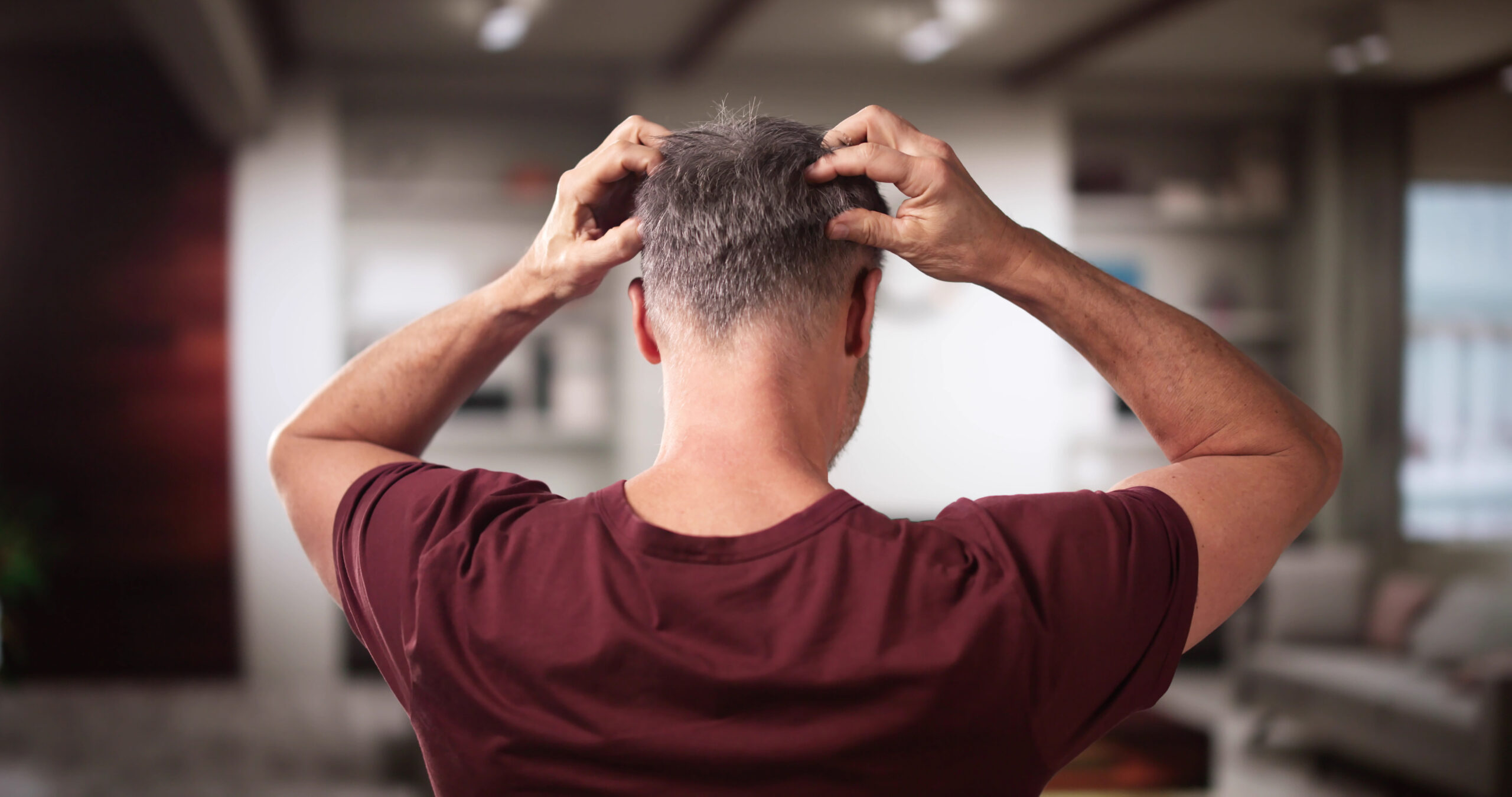 Man experiencing topical finasteride side effects