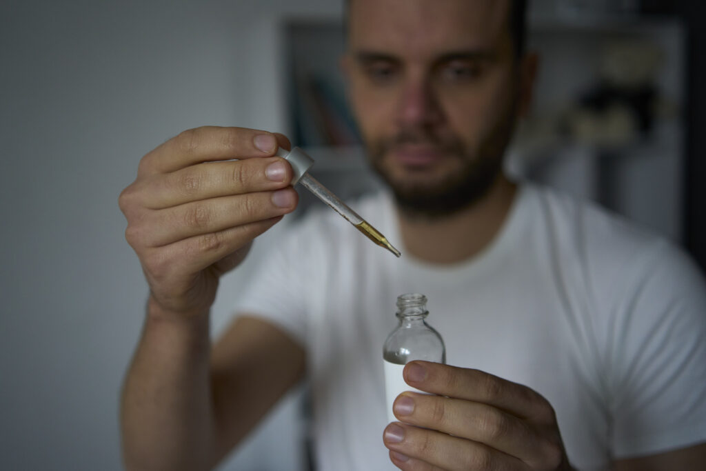 Man preparing to use minoxidil for eyebrows