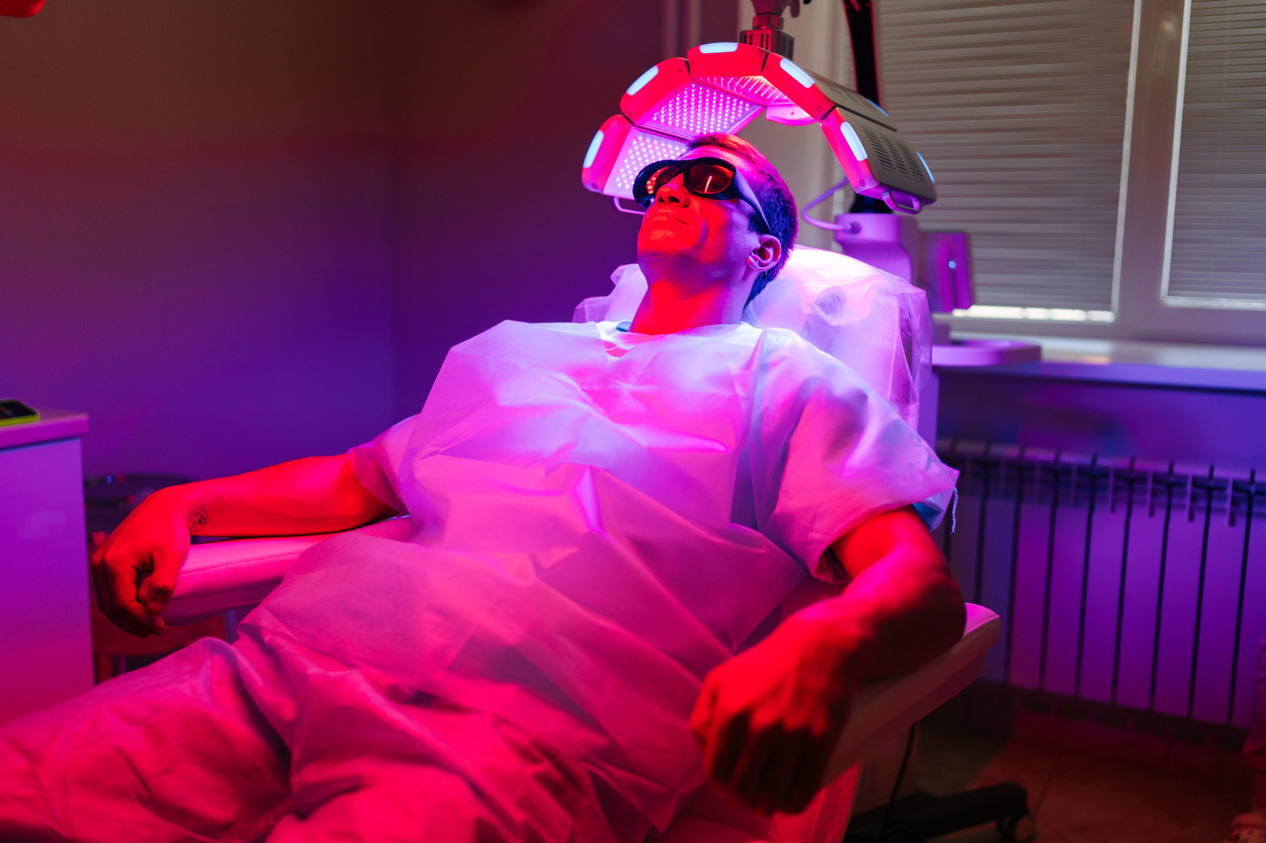 Patient getting red light therapy for hair loss